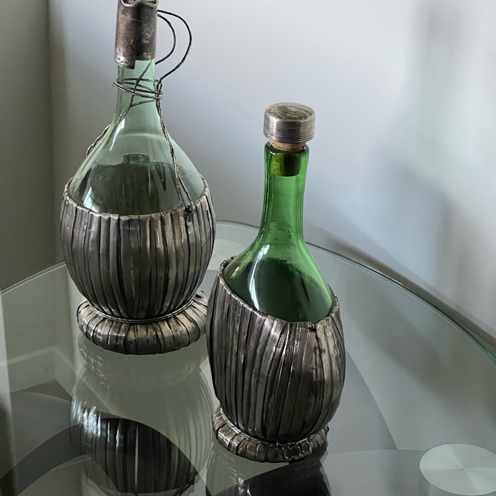 Silver basketed antique wine bottles